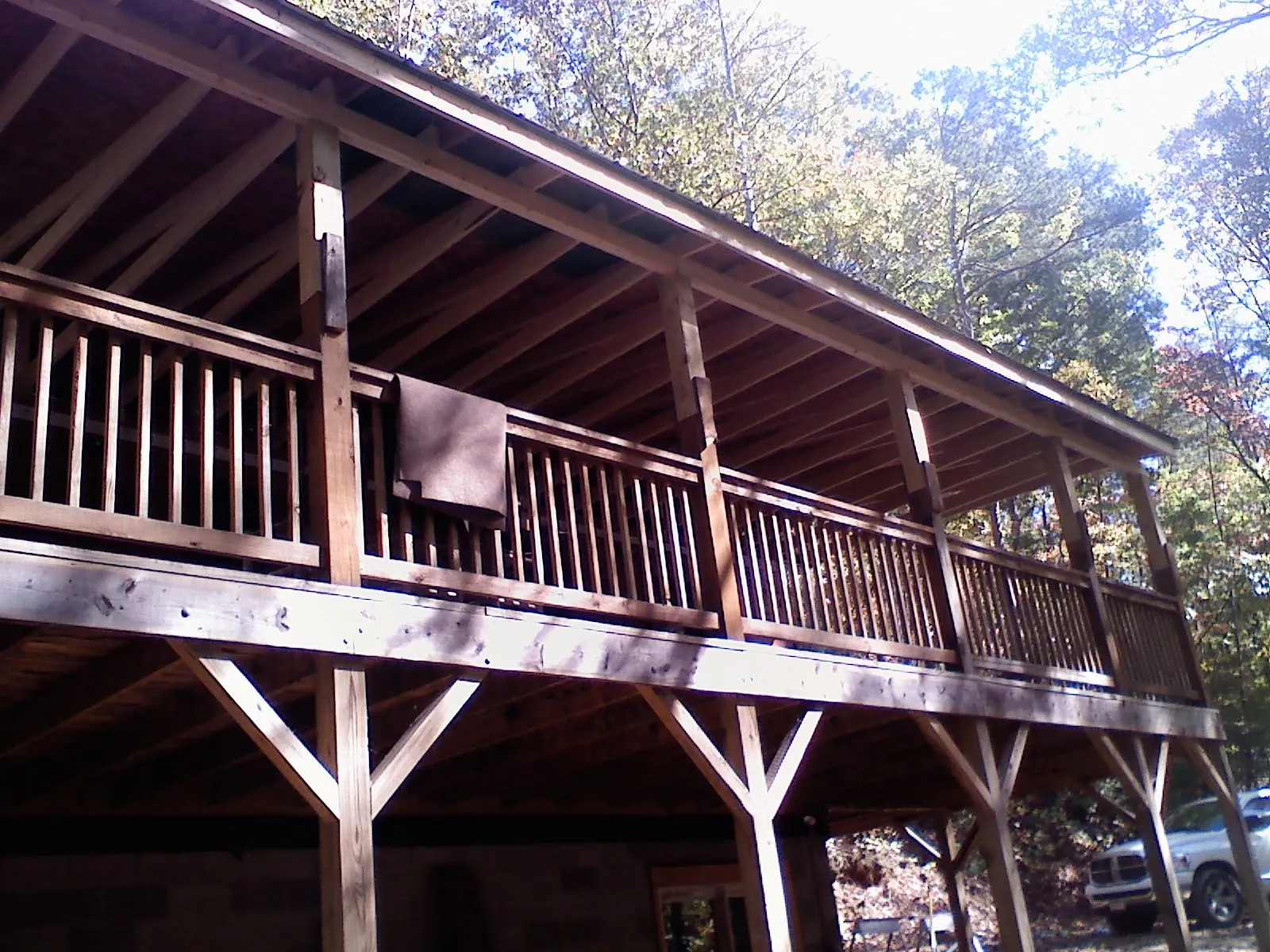 Timber framing under a new elevated porch and deck — Roof Leak Repair in West Valley City by Roofing Brothers